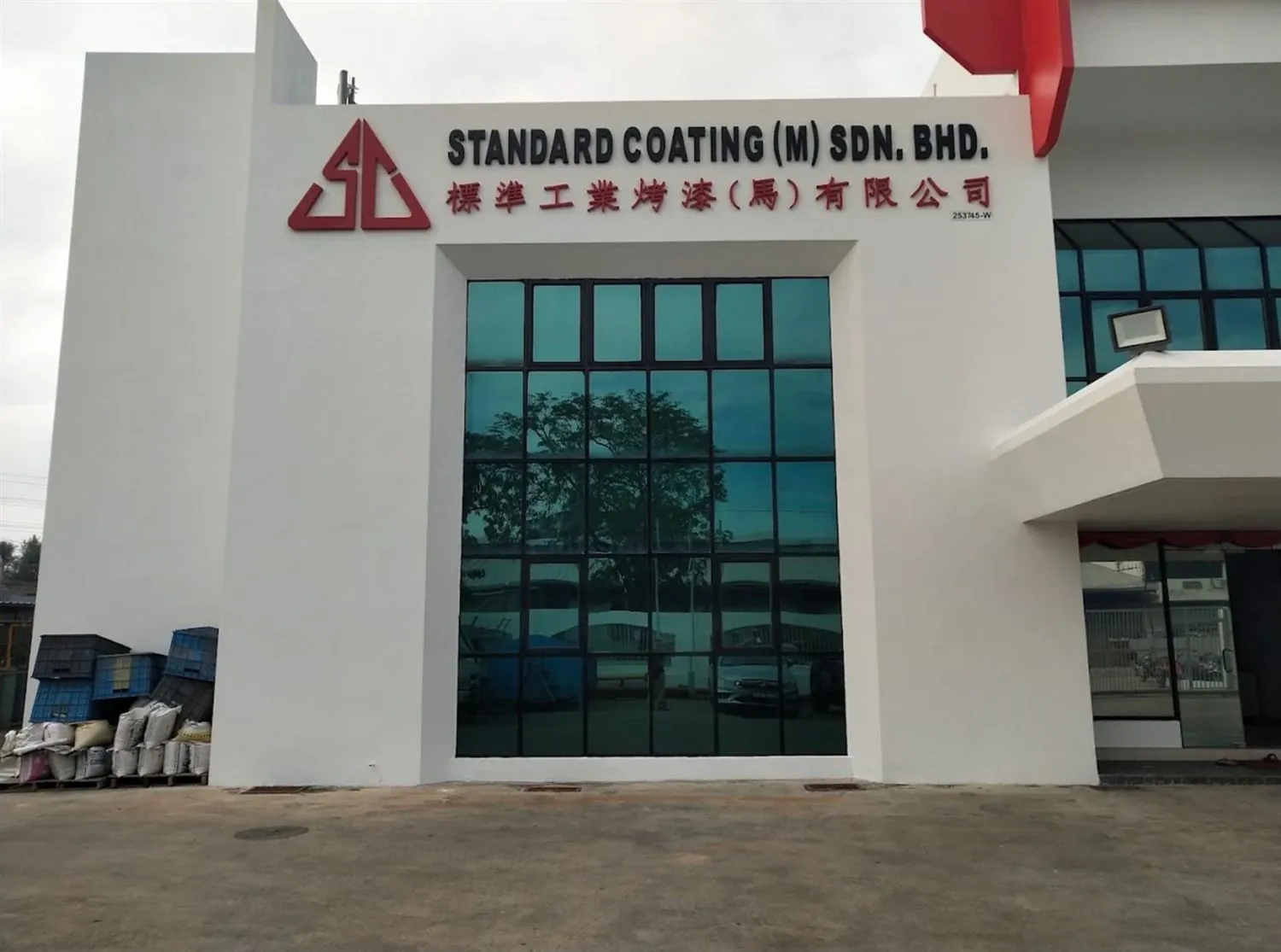 Front of the Standard Coating (M) Sdn Bhd building with company signage
